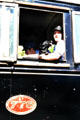 Locomotive driver and his dog on the steam train in Kingston. New Zealand.