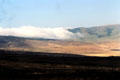 Clouds form over rim of Ngorongoro Crater. Tanzania.