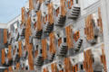 Abstract crow steps shape of traditional Scottish building gables behind staves on walls of Scottish Parliament. Edinburgh, Scotland