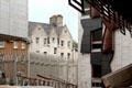 Modern architecture of Scottish Parliament embraces antique stone buildings of Royal Mile. Edinburgh, Scotland.