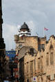 Upper end of Royal Mile approaching entrance to Edinburgh Castle with Outlook Tower of Camera Obscura & World of Illusions building. Edinburgh, Scotland