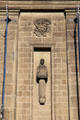 Sculpted figure by Hew Lorimer under rondel by E. Dempster on facade of National Library of Scotland. Edinburgh, Scotland.