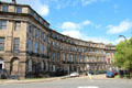 Curved frontage of 47-row houses forming classical palace block on Ainslie Place. Edinburgh, Scotland.