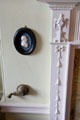 Adam-style parlour fireplace surround with profile bust & servant call bell at Georgian House museum. Edinburgh, Scotland.