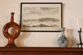 Ceramics on mantle under graphic of Culross town prospect at The Study. Culross, Scotland.