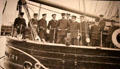 Photograph of Antarctica expedition officers at RRS Discovery Museum. Dundee, Scotland.