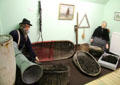 Baskets with fishing line for baited hooks plus tin tube to pass lines overboard without snagging at Scottish Fisheries Museum. Anstruther, Scotland.
