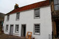 Cottage with lintel "17 GL4x BUILDING 77". Falkland, Scotland.
