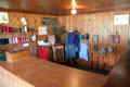 Tweed samples & bobbins in Craigdhu tweed weaving cottage at Highland Folk Museum. Newtonmore, Scotland.