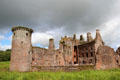 Caerlaverock Castle ruins sits in silted moat. Caerlaverock, Scotland.