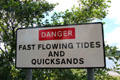 Danger Fast Flowing Tides and Quicksands sign at River Nith. Caerlaverock, Scotland.