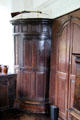 Corner door to hidden spiral staircase in The Hall at Craigievar Castle. Alford, Scotland.