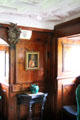Walls of Baltic pine stained with oxblood in ladies withdrawing room at Craigievar Castle. Alford, Scotland.