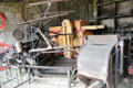 Reaper & binder in Museum of Farming Life at Pitmedden Garden. Pitmedden, Scotland.