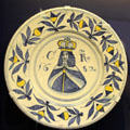 Ceramic charger with portrait & initials of King Charles II, made in Brislington close to Bristol, at Bristol Museum & Art Gallery. Bristol, England.