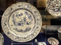 Exceptionally large English delftware dish with painting inspired by Chinese porcelain from late Ming Dynasty likely made for celebration of a marriage, likely made in Brislington, at Bristol Museum & Art Gallery. Bristol, England.