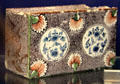 Ceramic medallions on flower brick made in Bristol at Bristol Museum & Art Gallery. Bristol, England.