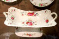 Ceramic floral serving plate on stand in Mansion House pattern, made at Bristol Pottery at Bristol Museum & Art Gallery. Bristol, England.