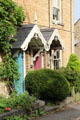 Ornately carved entrance roofs on row houses close to town center. Chipping Norton, England.