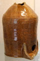 Brown glazed earthenware pot with shaped hole at Coalport China Museum. Ironbridge, England.