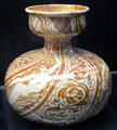 Mermaids and foliate ornamented vase painted in deep red lustre by Walter Crane for Maw & Co at Jackfield Tile Museum. Ironbridge, England.