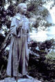 Statue of Padre Junipero Serra founder of the California mission system in garden of San Diego Mission. San Diego, CA.