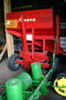 Wood gravity flow grain box wagon made in Amana at OPA's Tractor Barn Museum. West Amana, IA.