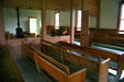 Interior of Friends or Quakers Meeting House divided between male & female sections on Herbert Hoover National Historic Site. West Branch, IA.