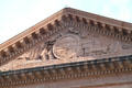 Town seal with sailing ships, rail & factory carvings in pediment of New Bedford City Hall. New Bedford, MA.