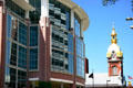 Curved front of 333 W 11th St. with Cathedral of Immaculate Conception beyond. Kansas City, MO.