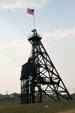 Mineshaft headframe surrounded by houses from era when miners walked to work. Butte, MT.