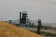 Mine headframes mark landscape of hills above Butte. Butte, MT.