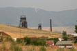 Mine headframes mark landscape of hills above Butte. Butte, MT.