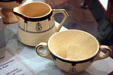 Roycroft orb & double barred cross pitcher & bowl by Dard Hunter of Buffalo Pottery for Roycrofters of East Aurora, NY at Buffalo History Museum. Buffalo, NY