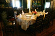 Dining room in Roosevelt home with chair left turned back to allow FDR access from his wheelchair. Hyde Park, NY.