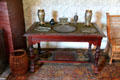 Side table with metal objects in reception room death room at Grant Cottage SHS. Wilton, NY.
