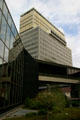 Tower 280 with projecting row of windows over black Xerox building. Rochester, NY.