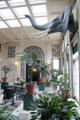 Conservatory with decorative entrance to dining room at far end at Eastman House. Rochester, NY.
