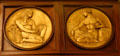 Relief roundels showing Papyrus & Chiseling methods of writing on Rush Rhees Library facade at University of Rochester. Rochester, NY.