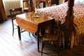 Drop leaf table in bedroom of Old Merchant's House Museum. New York, NY.
