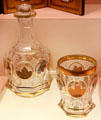 Decanter & beaker with spa scene medallions from Bohemia at Metropolitan Museum of Art. New York, NY.