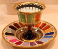 Porcelain goblet & saucer showing main colors used by Vienna factory of Imperial Porcelain Manufactory at Metropolitan Museum of Art. New York, NY.