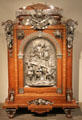 Veneered armoire with silvered mounts & plaque of King Merovech over forces of Attila the Hun in 451 by Jean Brandely, Charles-Guillaume Diehl & Emmanuel Frémiet of Paris at Metropolitan Museum of Art. New York, NY.