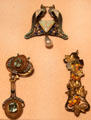 German pendant beside two Art Nouveau pendants by René-Jules Lalique of Paris at Metropolitan Museum of Art. New York, NY.
