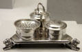 Silver triangular ink stand supported of lions by John Coney of Boston at Metropolitan Museum of Art. New York, NY.
