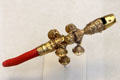 Gold & coral child's rattle, whistle & bells teething toy by Nicholas Roosevelt of New York City at Metropolitan Museum of Art. New York, NY.