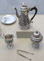 Silver coffeepot by Robert Peaston & William Peaston of London plus sugar bowl, creampot & tongs by Myer Myers of New York City at Metropolitan Museum of Art. New York, NY.