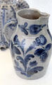 Stoneware pitcher painted with cobalt blue by John Bell Pottery of Waynesboro, PA at Metropolitan Museum of Art. New York, NY.