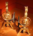 Aesthetic movement brass andirons with lions & sunflowers by Herter Brothers made for William H. Vanderbilt bedroom at Metropolitan Museum of Art. New York, NY.
