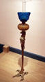 Kerosene lamp standard atop bronze bird with exaggerated claw by Pierre Emmanuel Guerin at Brooklyn Museum. Brooklyn, NY.